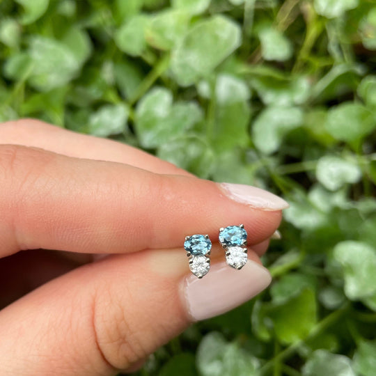holding a ‘Zoya’ Aquamarine & Diamond White Gold necklace & earrings