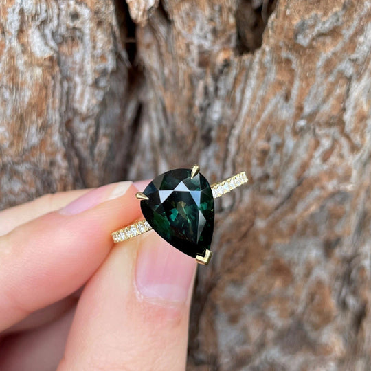 Holding the "HighWire Teardrop" 5.14ct Australian Sapphire Diamond Band Engagement Ring