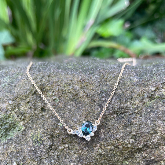 ‘Fleur’ Teal pear-cut Australian Sapphire and Diamond Necklace on stone