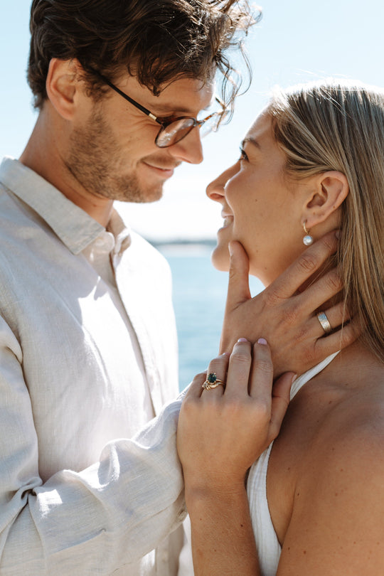 Woman wearing "Helmi" White Pearl & Yellow Gold Hoop Earrings