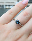 ‘Pia’ 1.19ct Teal Blue Australian Sapphire & Diamond Platinum Ring wearing on finger