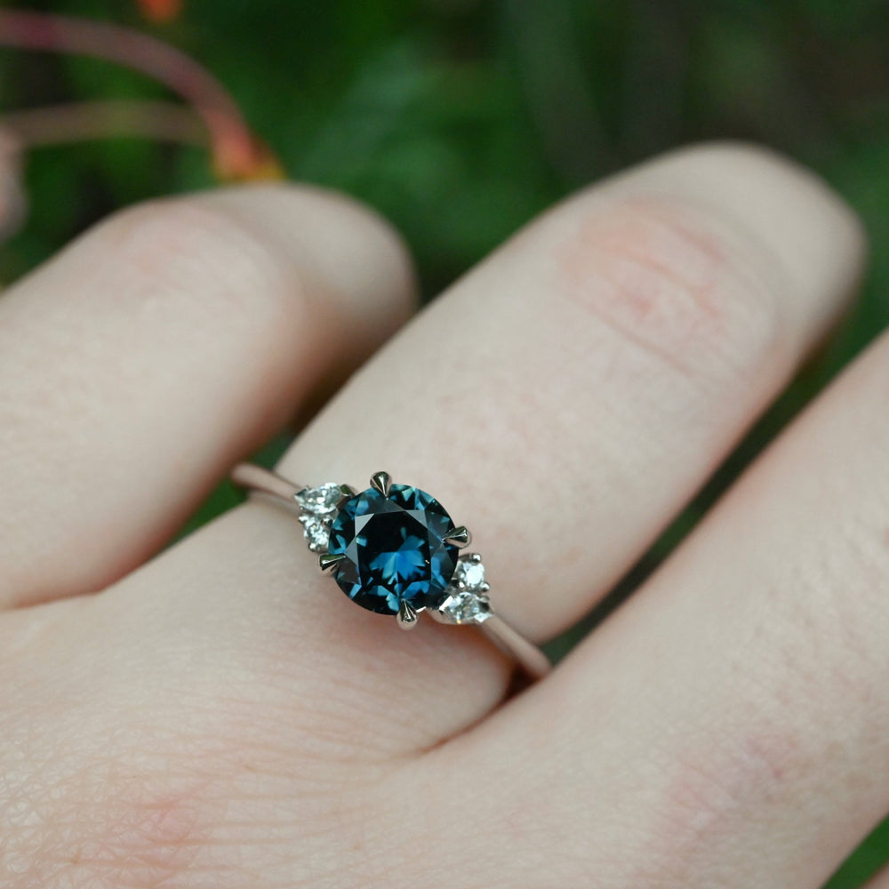 ‘Pia’ 1.19ct Teal Blue Australian Sapphire & Diamond Platinum Ring on hand